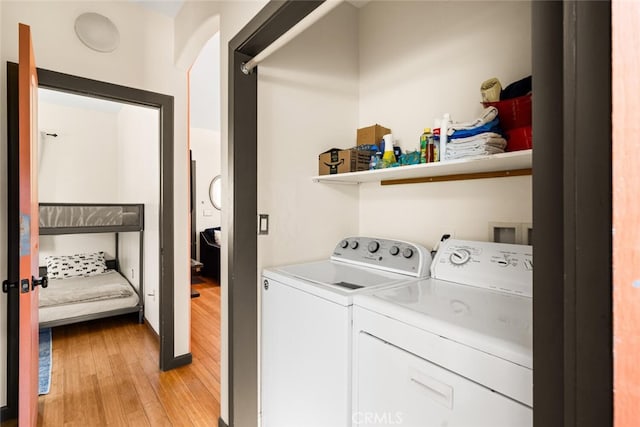 12760 Center Gap Rd, Chico, CA 95928 - laundry room featuring washing machine and dryer and light wood-style floors