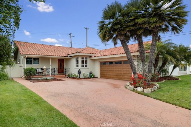 view of front of house featuring covered porch, a garage, curved driveway, stucco siding, and a tile roof