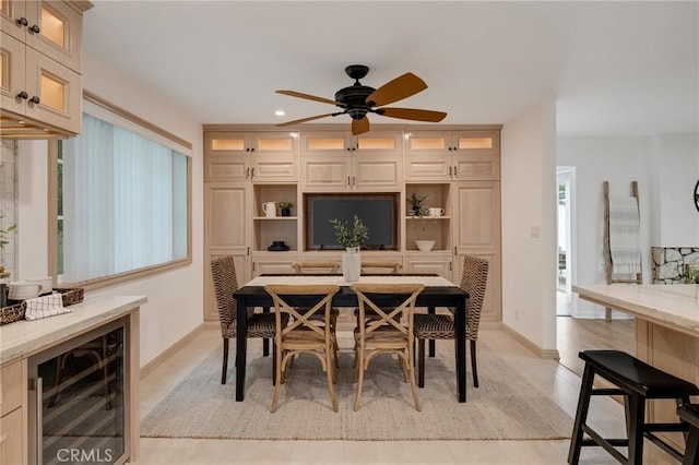dining area featuring beverage cooler, ceiling fan, recessed lighting, and baseboards
