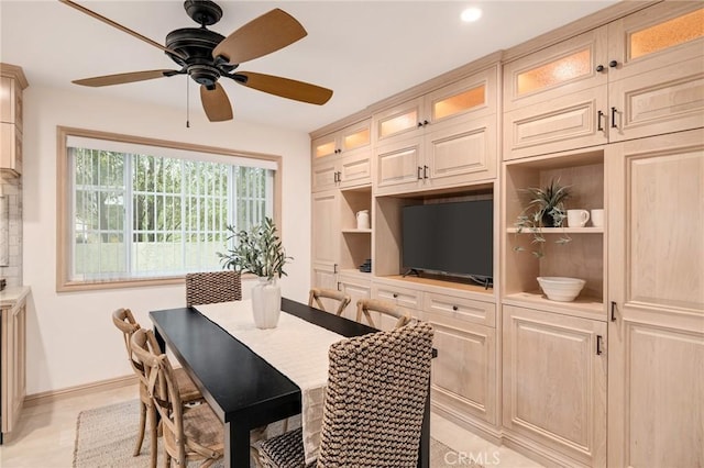 dining space with baseboards, a ceiling fan, and recessed lighting