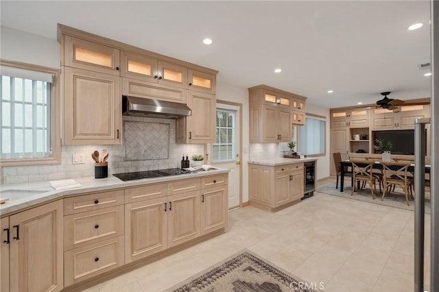 kitchen featuring wine cooler, black electric cooktop, under cabinet range hood, ceiling fan, and decorative backsplash