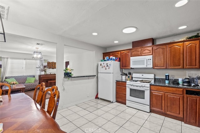 19903 Vanowen St, Winnetka, CA 91306 - kitchen featuring white appliances, brown cabinetry, recessed lighting, a textured ceiling, and baseboards