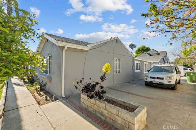 19903 Vanowen St, Winnetka, CA 91306 - view of side of property featuring stucco siding
