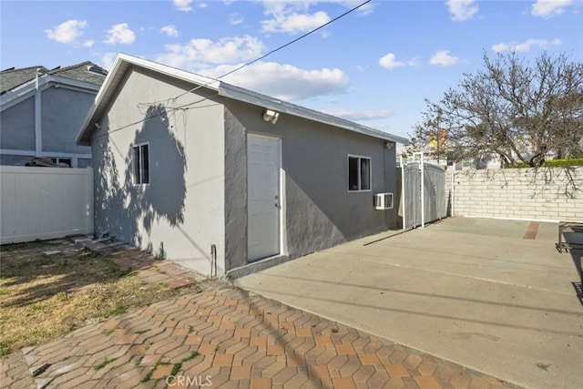 19903 Vanowen St, Winnetka, CA 91306 - back of property with stucco siding, a patio, and fence
