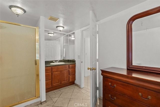 19903 Vanowen St, Winnetka, CA 91306 - bathroom with a stall shower, vanity, and tile patterned floors