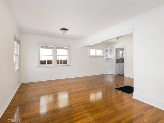 1122 Loma Dr, Hermosa Beach, CA 90254 - unfurnished room with wood finished floors, baseboards, and crown molding