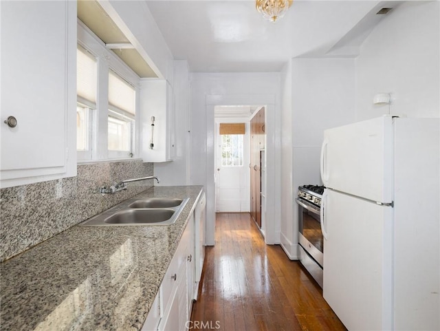 1122 Loma Dr, Hermosa Beach, CA 90254 - kitchen with white appliances, a sink, white cabinets, and dark wood-style flooring