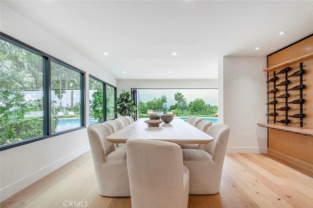 18101 Green Meadow Dr, Encino, CA 91316 - dining area featuring baseboards, light wood-type flooring, healthy amount of natural light, and recessed lighting
