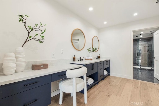 18101 Green Meadow Dr, Encino, CA 91316 - full bath with double vanity, recessed lighting, wood finished floors, a shower stall, and baseboards