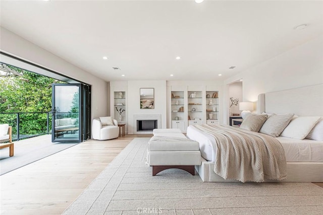 18101 Green Meadow Dr, Encino, CA 91316 - bedroom featuring light wood-type flooring, recessed lighting, access to outside, and a fireplace