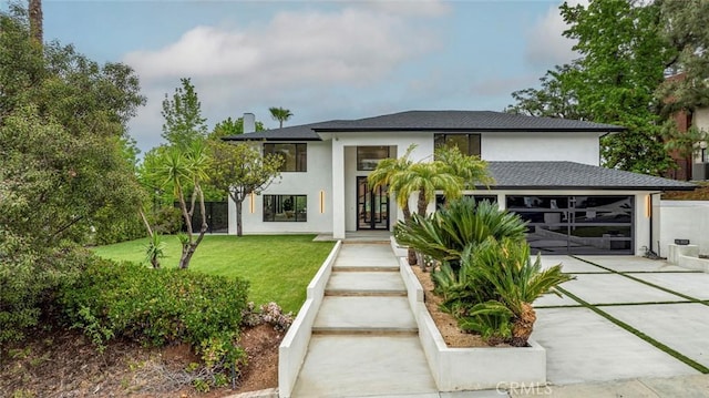 18101 Green Meadow Dr, Encino, CA 91316 - view of front of property with an attached garage, stucco siding, and driveway