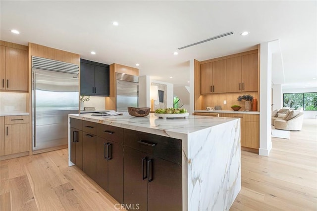 18101 Green Meadow Dr, Encino, CA 91316 - kitchen with built in fridge, light wood-type flooring, a center island, and recessed lighting
