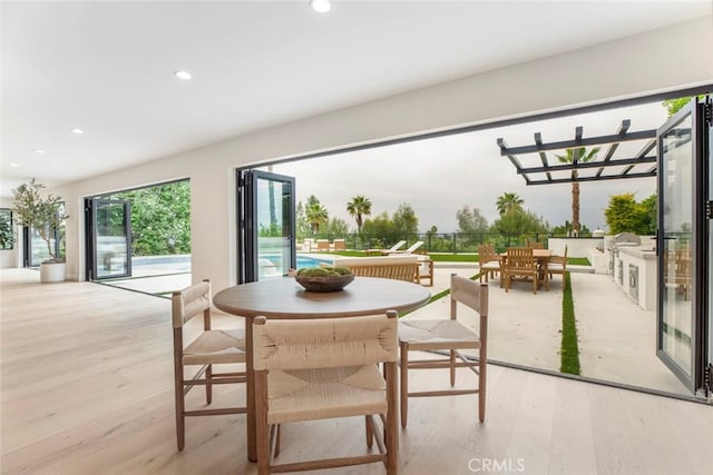 18101 Green Meadow Dr, Encino, CA 91316 - dining room featuring wood finished floors and recessed lighting