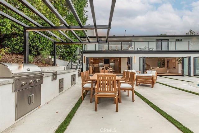 18101 Green Meadow Dr, Encino, CA 91316 - view of patio / terrace with stairs, an outdoor living space, outdoor dining space, and a sink