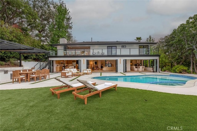18101 Green Meadow Dr, Encino, CA 91316 - back of house featuring outdoor lounge area, a balcony, and a patio