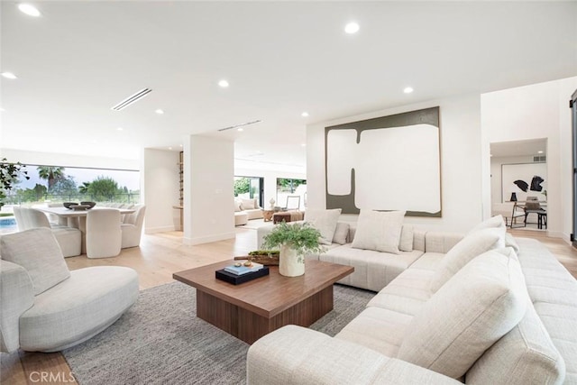 18101 Green Meadow Dr, Encino, CA 91316 - living room with light wood-style flooring and recessed lighting