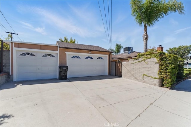 2150 N Eastern Ave, Los Angeles, CA 90032 - garage featuring driveway, fence, and central AC