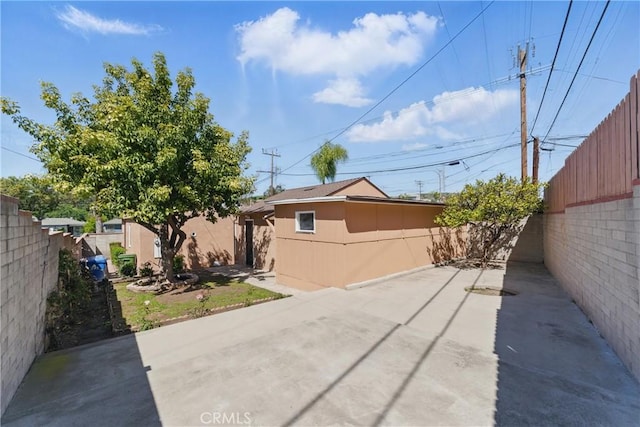 2150 N Eastern Ave, Los Angeles, CA 90032 - view of side of property with a patio and a fenced backyard