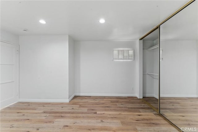 2150 N Eastern Ave, Los Angeles, CA 90032 - unfurnished bedroom with a closet, recessed lighting, wood finished floors, and baseboards