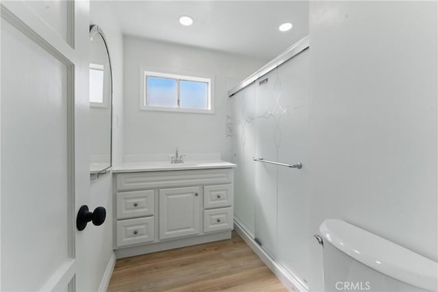 2150 N Eastern Ave, Los Angeles, CA 90032 - bathroom with vanity, toilet, and wood finished floors