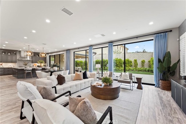 living area featuring recessed lighting and light wood-type flooring