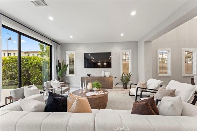 living area featuring recessed lighting and wood finished floors