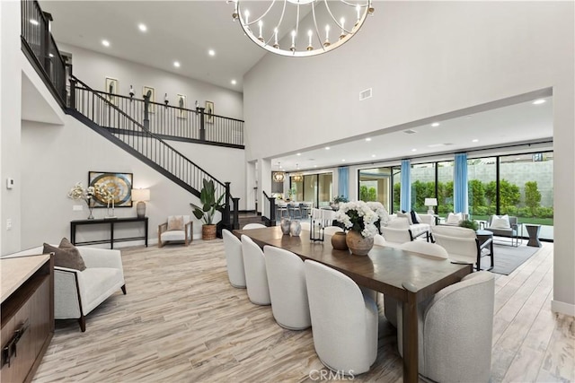 building lobby with a high ceiling, recessed lighting, and stairs