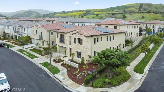aerial perspective of suburban area with mountains