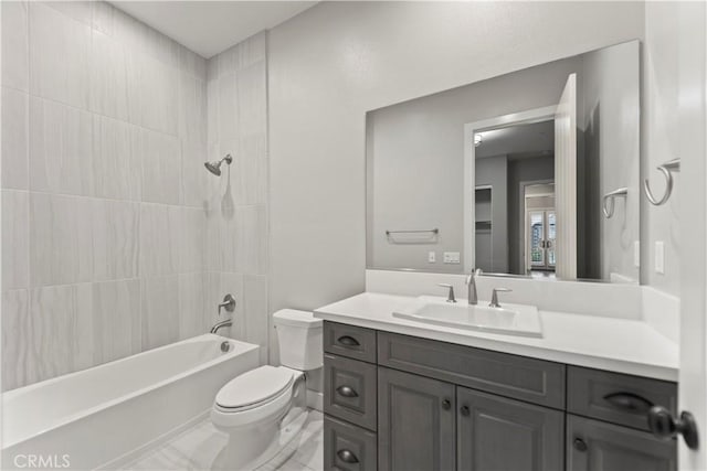 bathroom with toilet, vanity, and tub / shower combination