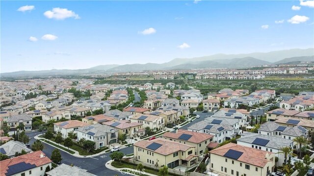 aerial view of residential area featuring a mountain backdrop