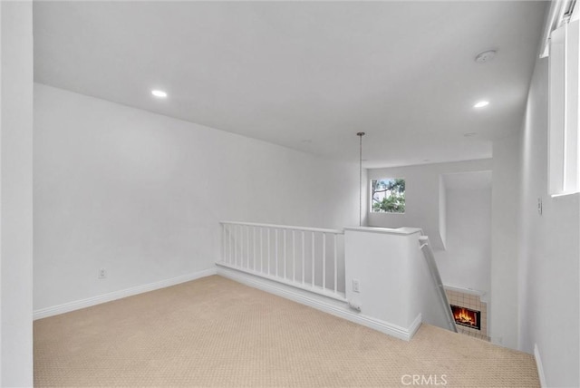 unfurnished room featuring carpet floors, recessed lighting, a smoke detector, and baseboards