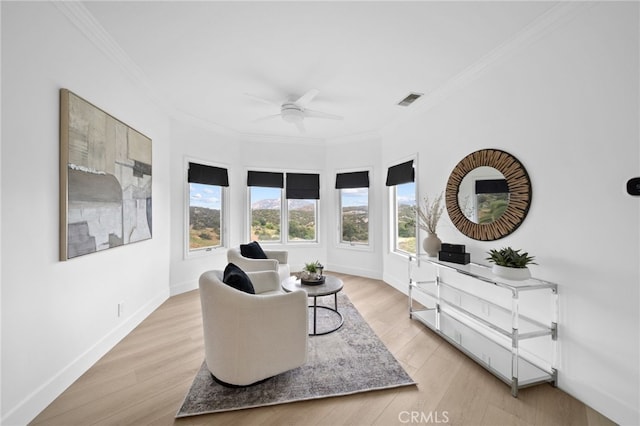 34105 Stage Rd, Temecula, CA 92592 - living area featuring ceiling fan, crown molding, light wood-style flooring, and baseboards