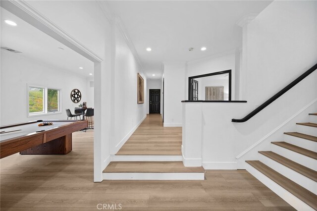 34105 Stage Rd, Temecula, CA 92592 - stairway with wood finished floors, ornamental molding, recessed lighting, billiards, and baseboards
