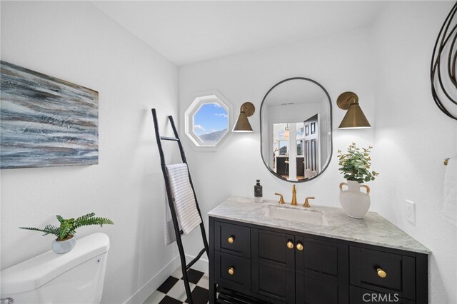 34105 Stage Rd, Temecula, CA 92592 - half bathroom featuring tile patterned floors, toilet, vanity, and baseboards