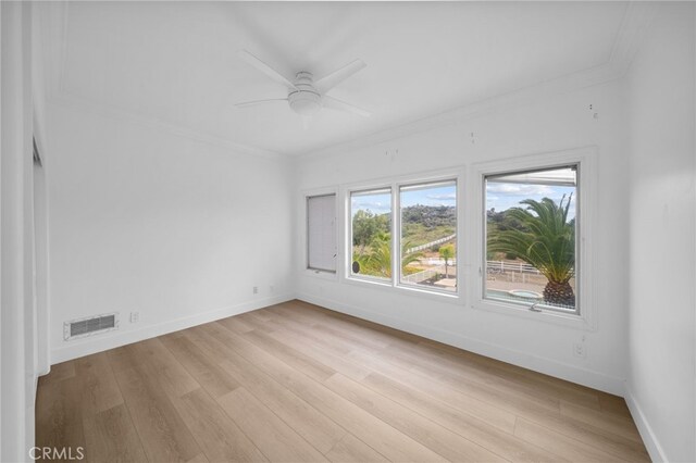 34105 Stage Rd, Temecula, CA 92592 - empty room with crown molding, light wood-style floors, a ceiling fan, and baseboards