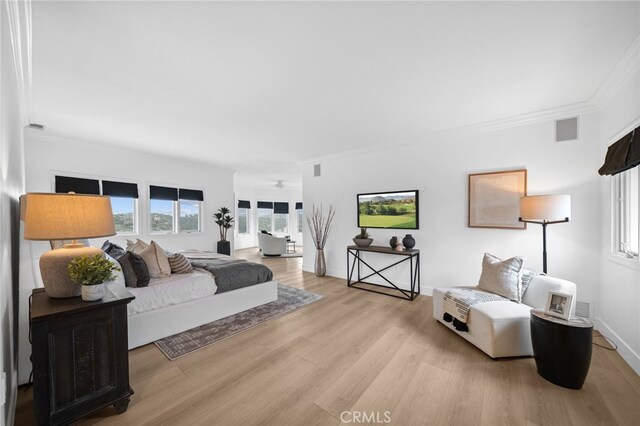 34105 Stage Rd, Temecula, CA 92592 - bedroom featuring light wood-style floors, crown molding, and baseboards