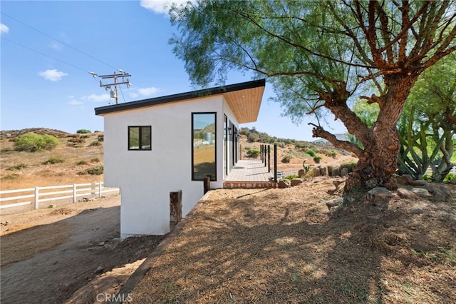 34105 Stage Rd, Temecula, CA 92592 - view of property exterior featuring stucco siding and fence