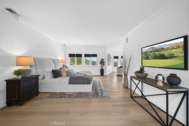 34105 Stage Rd, Temecula, CA 92592 - bedroom with ornamental molding, wood finished floors, and baseboards