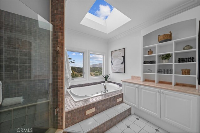 34105 Stage Rd, Temecula, CA 92592 - bathroom featuring a skylight, ornamental molding, a stall shower, a tub with jets, and tile patterned floors