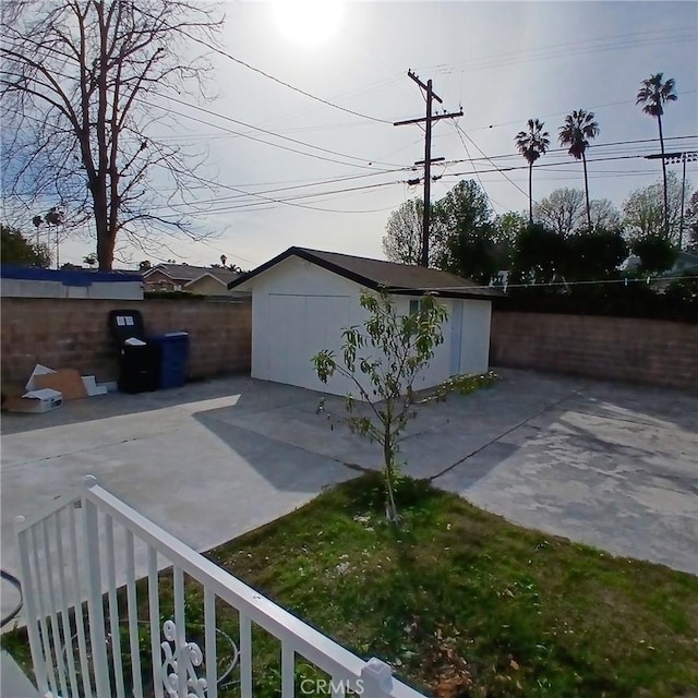 5109 S 7th Ave, Los Angeles, CA 90043 - view of side of property with a patio, an outbuilding, fence, and a storage unit