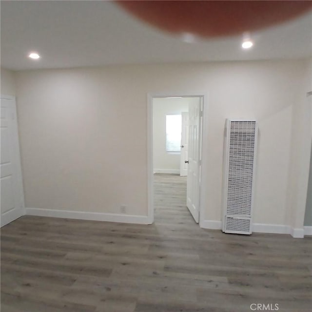 5109 S 7th Ave, Los Angeles, CA 90043 - unfurnished room featuring a heating unit, wood finished floors, baseboards, and recessed lighting