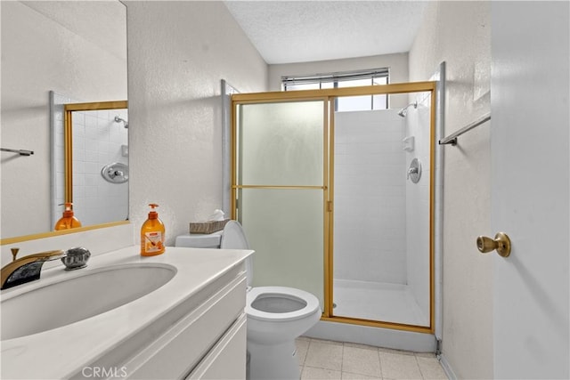 22244 Croll Ct, Diamond Bar, CA 91765 - full bathroom with a textured wall, a shower stall, toilet, tile patterned floors, and vanity