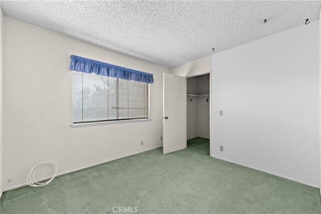 22244 Croll Ct, Diamond Bar, CA 91765 - unfurnished bedroom featuring carpet floors, a textured ceiling, and a closet