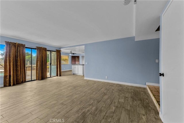 22244 Croll Ct, Diamond Bar, CA 91765 - unfurnished living room featuring wood finished floors, a ceiling fan, and baseboards