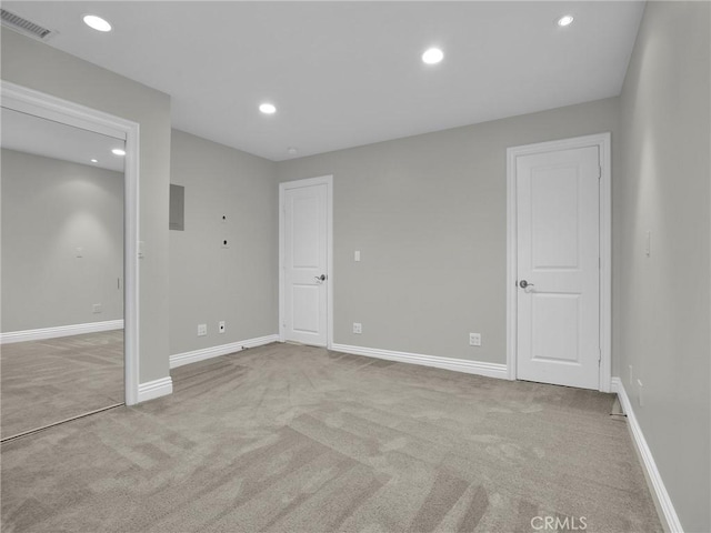 unfurnished bedroom with carpet flooring, recessed lighting, and baseboards