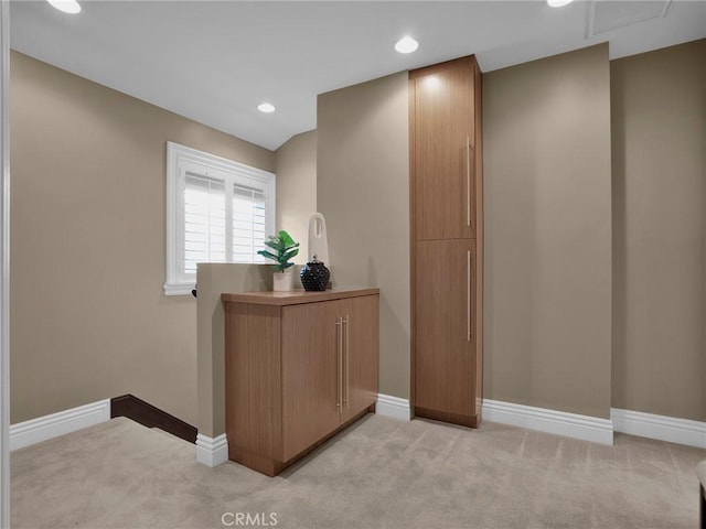 corridor featuring light colored carpet, baseboards, and recessed lighting