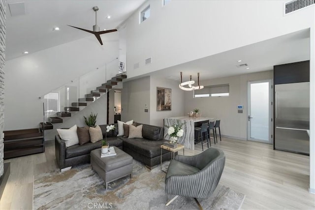 29 W Neapolitan Ln, Long Beach, CA 90803 - living area with a high ceiling, stairs, light wood finished floors, recessed lighting, and a ceiling fan