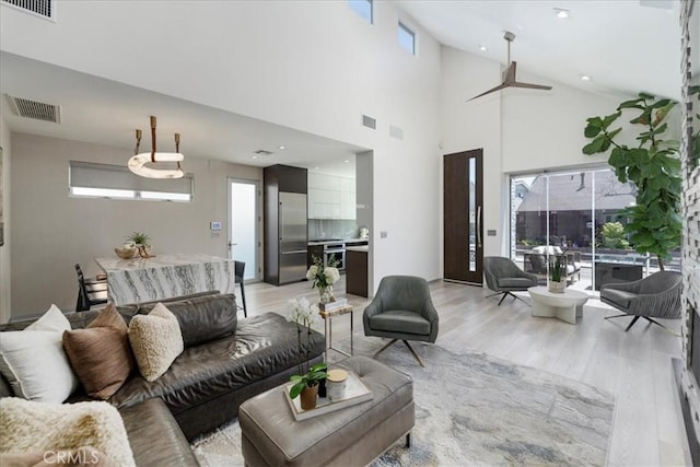 29 W Neapolitan Ln, Long Beach, CA 90803 - living room featuring light wood-style floors, high vaulted ceiling, and recessed lighting