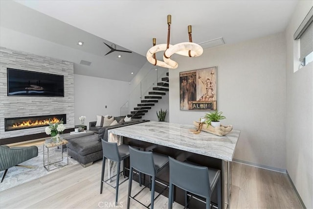 29 W Neapolitan Ln, Long Beach, CA 90803 - dining room featuring light wood-style flooring and a fireplace