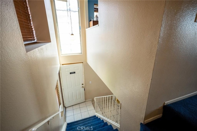13117 Pan Am Blvd, Moreno Valley, CA 92553 - stairs featuring tile patterned flooring and a textured wall
